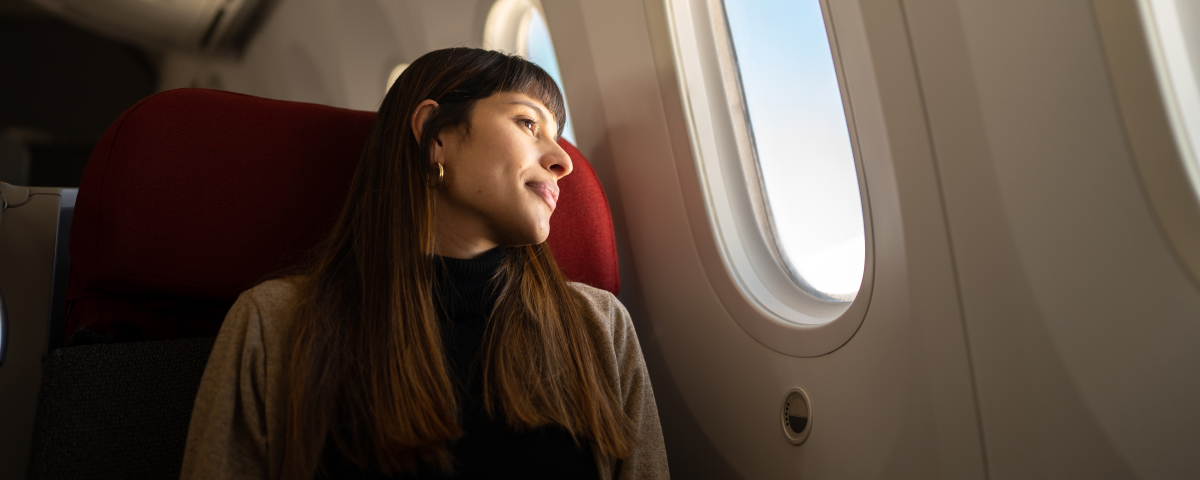 Exchange for Airline Miles - Airplane Window Seat Image
