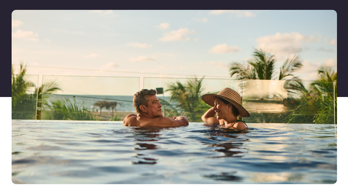 Older Couple Enjoying Beachside Resort Pool
