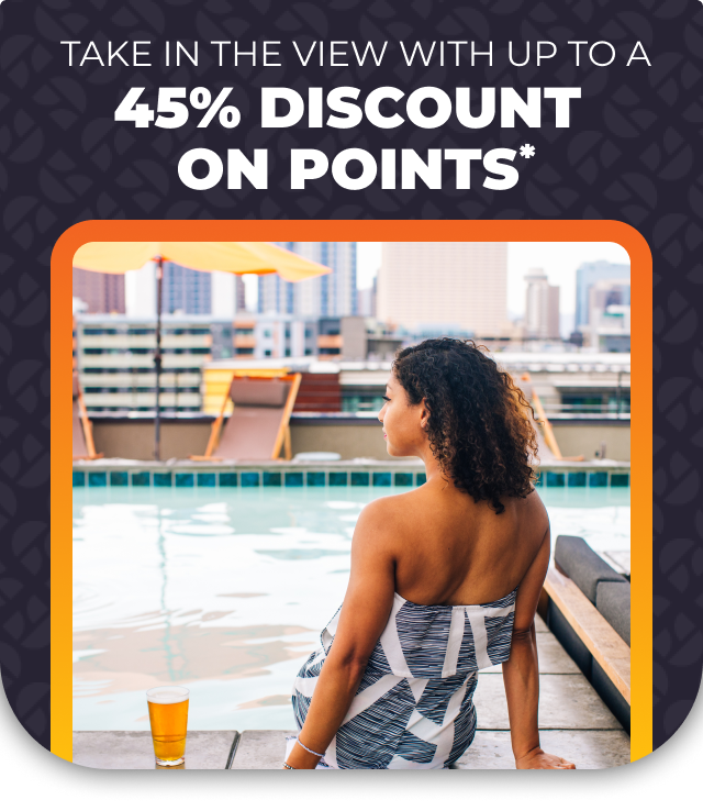 Photo of a woman sitting poolside with text 'TAKE IN THE VIEW WITH UP TO A 45% DISCOUNT ON POINTS*'