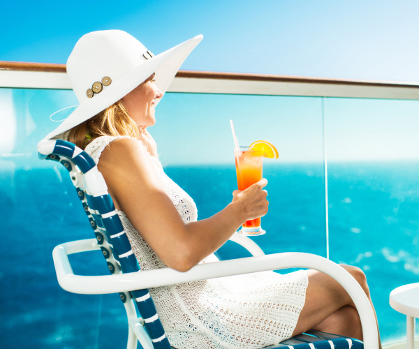 Photo of a woman sitting on the deck of a cruise ship
