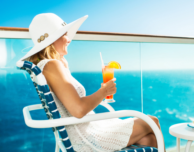Photo of a woman sitting on the deck of a cruise ship